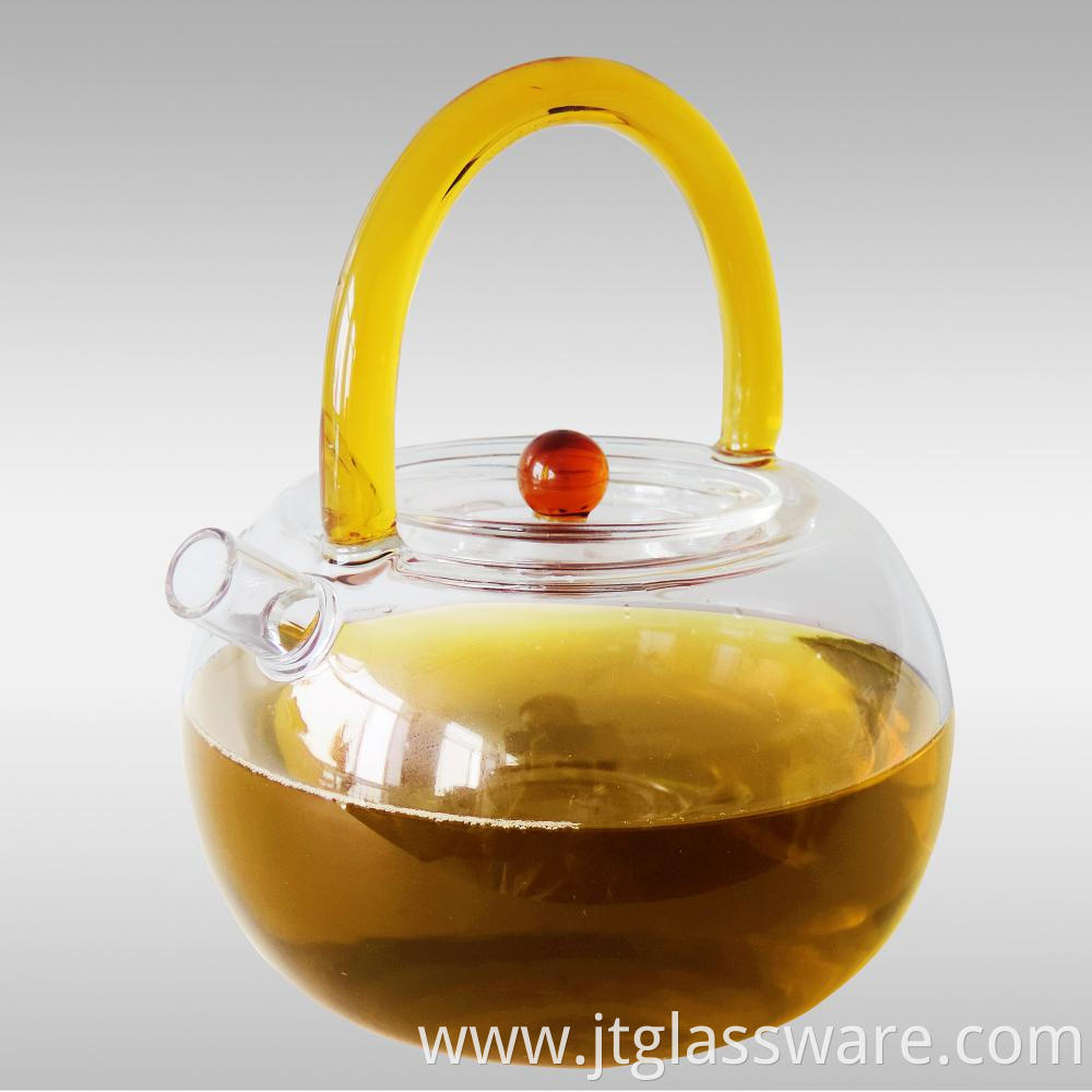 glass teapot with kind of handle